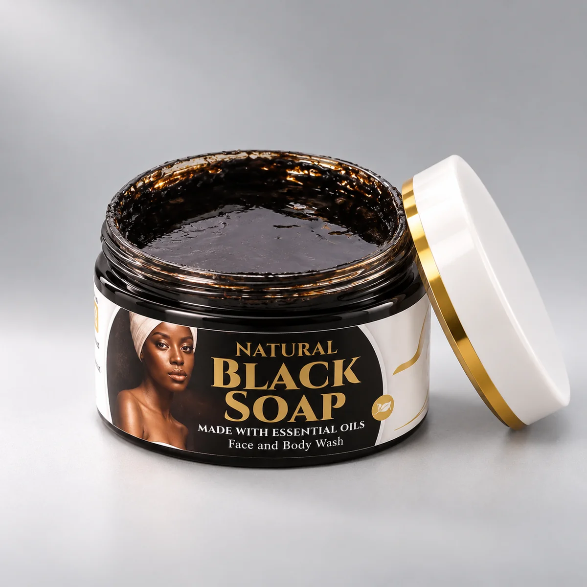Open 100g jar of Success Self Care Natural Black Soap Face and Body Wash showing the dark, soft soap